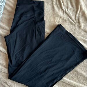 Athleta Black flare leggings with side pockets
